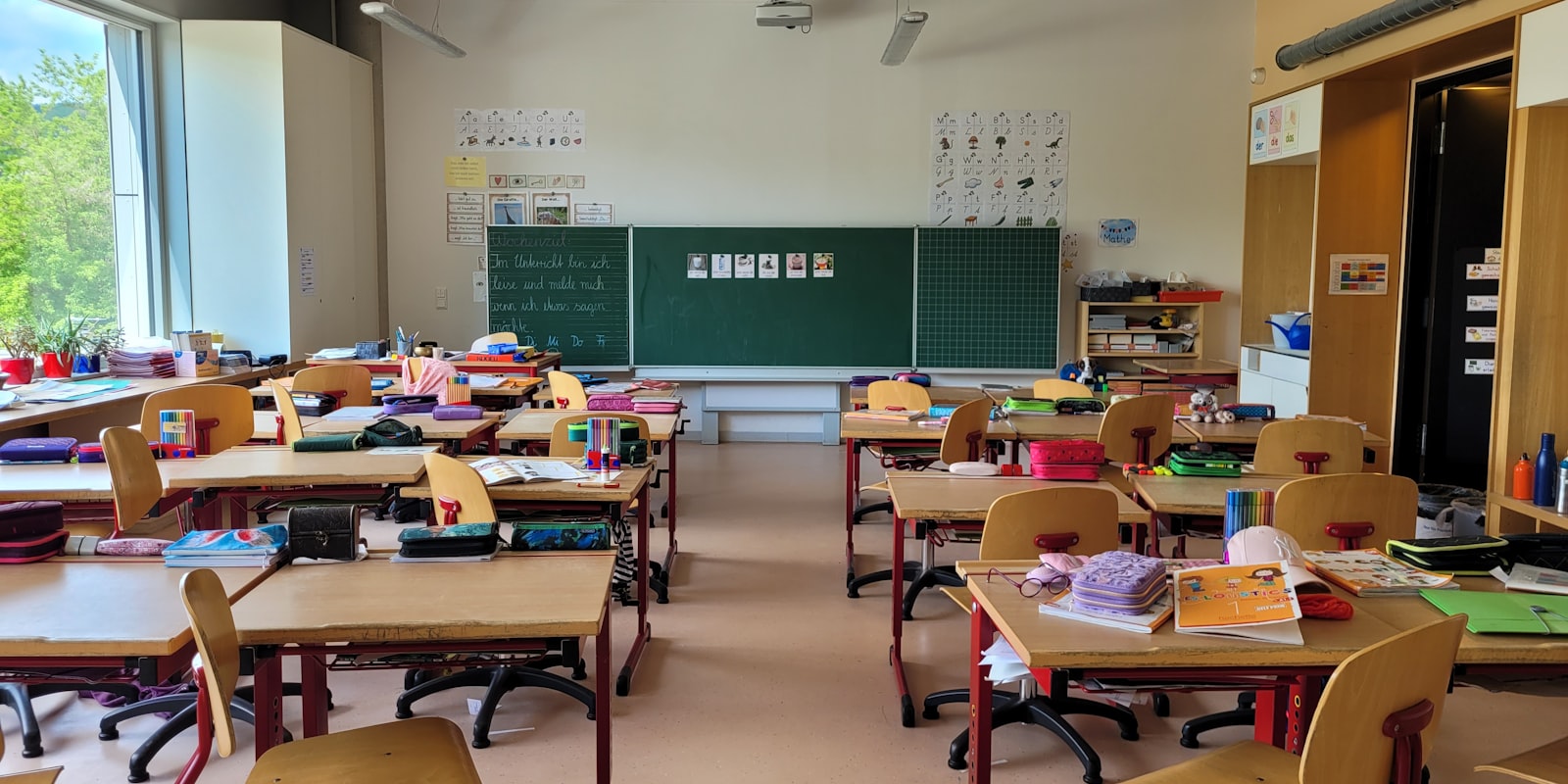 Empty classroom with rows of desks and chairs
